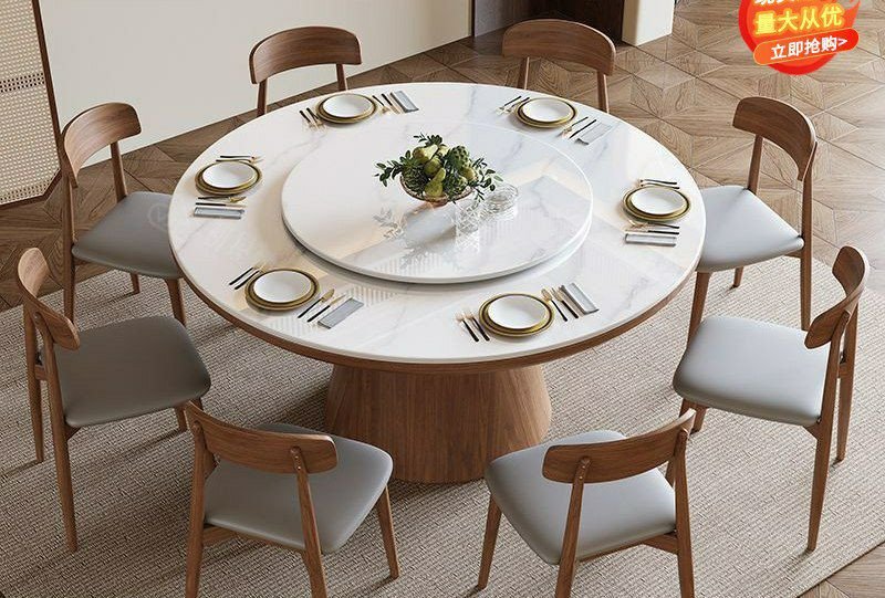 Table à manger ronde moderne en bois avec un plateau en pierre frittée et un plateau tournant central (type Lazy Susan), accompagnée de huit chaises assorties au dossier incurvé et à l'assise grise.